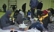 A group of would-be immigrants from various African countries, whom authorities said were found off the coast of Djerba after water seeped into their boat, rest at the port in Zarzis March 4, 2015. PHOTO BY REUTERS/Stringer