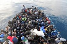 Migrants are seen in a boat as they are rescued by Libyan coast guards in the Mediterranean Sea off the coast of Libya, January 15, 2018. PHOTO BY REUTERS/Hani Amara