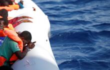 Migrants are seen during rescue operation in the Mediterranean Sea, October 20, 2016. PHOTO BY REUTERS/Yara Nardi/Italian Red Cross press office