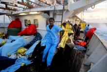 Alaedba, 20, from Senegal, sits aboard the former fishing trawler Golfo Azzurro of the Spanish NGO Proactiva Open Arms, after being rescued with other migrants near the coasts of Libya, in the central Mediterranean Sea, January 28, 2017. PHOTO BY REUTERS/Giorgos Moutafis