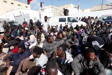 African migrant sit at a detention camp in Tripoli, Libya, February 21, 2017. PHOTO BY REUTERS/Ismail Zitouny