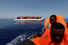 Migrants react after being rescued by the Malta-based NGO Migrant Offshore Aid Station (MOAS) ship Phoenix during a rescue operation in the central Mediterranean, in international waters off the Libyan coastal town of Sabratha, May 4, 2017. PHOTO BY REUTERS/Darrin Zammit Lupi