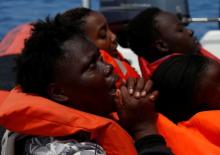 A migrant reacts after being rescued by the Malta-based NGO Migrant Offshore Aid Station (MOAS) ship Phoenix during a rescue operation in the central Mediterranean in international waters, off the Libyan coastal town of Sabratha, May 4, 2017. PHOTO BY REUTERS/Darrin Zammit Lupi