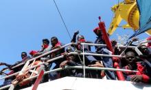 Migrants wait to disembark from the Vos Hestia ship as they arrive at the Crotone harbour, after being rescued by a "Save the Children" crew in the Mediterranean sea off the Libya coast, in Crotone, Italy, June 21, 2017. PHOTO BY REUTERS/Stefano Rellandini