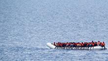 Migrants wait to be rescued by "Save the Children" NGO crew in the Mediterranean sea off Libya coast, June 18, 2017. PHOTO BY REUTERS/Stefano Rellandini