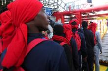 Migrants waits to disembark from the Vos Hestia ship as they arrives in the Crotone harbour, Italy, after being rescued by " Save the Children" crew in the Mediterranean sea off the Libya coast, June 21, 2017. PHOTO BY REUTERS/Stefano Rellandini