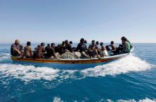 Migrants ride in a boat after they were rescued by Libyan coastguard off the coast of Gharaboli, east of Tripoli, Libya, July 8, 2017. PHOTO BY REUTERS/Ismail Zitouny