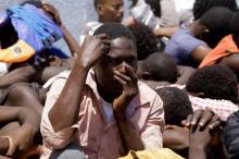 Migrants sit at the Tajoura branch of the Anti-Illegal Immigration Authority, in Tajoura, Libya, August 6, 2017. PHOTO BY REUTERS/Ismail Zitouny