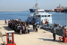 Migrants line up upon their arrival at a naval base after they were rescued by Libyan coastguard, in Tripoli, Libya, August 29, 2017. PHOTO BY REUTERS/Hani Amara