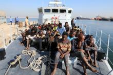 Migrants in a boat arrive at a naval base after they were rescued by Libyan coastguard, in Tripoli, Libya, August 29, 2017. PHOTO BY REUTERS/Hani Amara