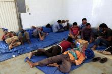 A migrant rests at a temporary detention centre after being rescued by Tunisian authorities in Ben Guerdane, Tunisia, June 16, 2015. PHOTO BY REUTERS/Anis Mili