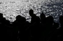 Migrants intercepted aboard a dinghy off the coast in the Strait of Gibraltar, are seen on a rescue boat after arriving at the Port of Algeciras, southern Spain, June 30, 2018. PHOTO BY REUTERS/Jon Nazca