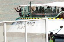 The Open Arms rescue boat run by the Spanish Proactiva Open Arms charity, arrives to port carrying migrants rescued off Libya, after Italy and Malta, both much closer to the place of rescue, had refused to let it dock in their ports, in Barcelona, Spain, July 4, 2018. PHOTO BY REUTERS/Albert Gea