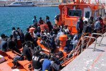 Migrants, intercepted aboard dinghies off the coast in the Strait of Gibraltar, are seen on a rescue boat as they wait to disembark after arriving at the port of Tarifa, southern Spain, July 26, 2018. PHOTO BY REUTERS/Jon Nazca