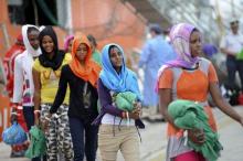 Migrants disembark from the Norwegian vessel Siem Pilot Stavanger in the Sicilian harbour of Palermo, Italy, June 24, 2015. PHOTO BY REUTERS/Guglielmo Mangiapane