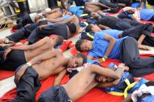 Migrants are seen resting on board the MV Aquarius rescue ship run by SOS Mediterranee organisation and Doctors Without Borders during a search and rescue (SAR) operation in the Mediterranean Sea, off the Libyan Coast, August 12, 2018. PHOTO BY REUTERS/Guglielmo Mangiapane