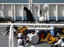 Surviving immigrants lie on the deck of the Italian coastguard ship Bruno Gregoretti in Senglea, in Valletta's Grand Harbour, April 20, 2015. PHOTO BY REUTERS/Darrin Zammit Lupi