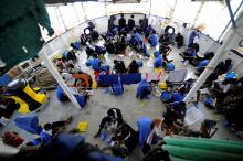 Migrants are seen on board the MV Aquarius, in the Mediterranean Sea, between Malta and Linosa, August 14, 2018. PHOTO BY REUTERS/Guglielmo Mangiapane