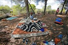 African migrants rest in their hiding place in the Moroccan mountains near the city of Tangier, Morocco, September 6, 2018. PHOTO BY REUTERS/Youssef Boudlal