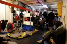 Migrants rest on the migrant search and rescue ship Sea-Watch 3, operated by German NGO Sea-Watch, off the coast of Malta in the central Mediterranean Sea, January 3, 2019. PHOTO BY REUTERS/Darrin Zammit Lupi