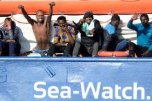 Migrants react as they rest on board the Sea Watch 3 off the coast of Siracusa, Italy, January 27, 2019. PHOTO BY REUTERS/Guglielmo Mangiapane