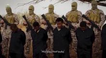 Islamic State militants stand behind what are said to be Ethiopian Christians in Wilayat Fazzan, in this still image from an undated video made available on a social media website on April 19, 2015. PHOTO BY REUTERS/Social Media Website via Reuters TV