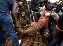 A rescued artisanal miner is carried from a pit as retrieval efforts proceed for trapped illegal gold miners in Kadoma, Zimbabwe, February 16, 2019. PHOTO BY REUTERS/Philimon Bulawayo