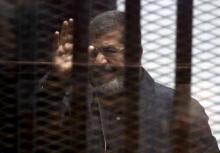 Ousted Egyptian President Mohamed Mursi is seen behind bars during his trial at a court in Cairo, April 30, 2015. PHOTO BY REUTERS/Al Youm Al Saabi Newspaper