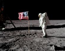 Astronaut Buzz Aldrin, lunar module pilot for Apollo 11, poses for a photograph beside the deployed United States flag during an extravehicular activity (EVA) on the moon, July 20, 1969. The lunar module (LM) is on the left, and the footprints of the astronauts are visible in the soil. PHOTO BY REUTERS/Neil Armstrong/NASA