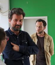 British photojournalist Phil Moore (R) and French journalist Jean Philippe Remy meet French embassy staff in the hallway outside the Prosecutor's office in Burundi's capital Bujumbura, January 29, 2016. PHOTO BY REUTERS/Jean Pierre Aime Harerimana