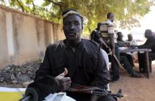 Morris Enoch, a leader of traditional militia hunters helping the army to fight the Boko Haram insurgence in the northeast region of Nigeria, speaks during an interview in Yola, Adamawa State, January 14, 2015. PHOTO BY REUTERS/Afolabi Sotunde