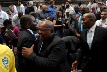 Mosiuoa Lekota (C) of the opposition party, Congress of the People (COPE) celebrates with Kevin Malunga deputy public protector after South Africa's constitutional court ordered President Jacob Zuma to pay back some of the $16 million of state money spent upgrading his private home in Johannesburg, March 31, 2016. PHOTO BY REUTERS/Felix Dlangamandla