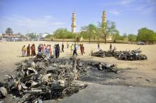 Security and emergency agency staff investigate the Kano Central Mosque bombing scene in Kano, November 29, 2014. PHOTO BY REUTERS/Stringer