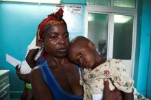 A mother holds her child suffering from yellow fever at a hospital in Luanda, Angola, March 15, 2016. PHOTO BY REUTERS/Herculano Coroado