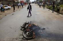 A motorbike, which was burnt by protesters who are against President Pierre Nkurunziza's decision to run for a third term, is seen along a street in Bujumbura, Burundi, May 30, 2015. PHOTO BY REUTERS/Goran Tomasevic