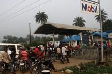 Motorists queue to buy petrol at a fuel station in Ahaoda in Nigeria's oil state in the Delta region, in a file photo. PHOTO BY REUTERS/Akintunde Akinleye