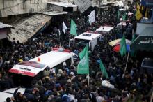 Mourners gather around ambulances carrying the bodies of seven Palestinian Hamas gunmen, who were killed when a tunnel collapsed close to the Gaza Strip's eastern border with Israel during their funeral in Gaza City, January 29, 2016. PHOTO BY REUTERS/Suhaib Salem