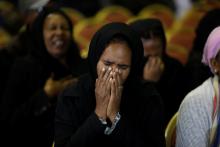 A mourner reacts during a memorial ceremony for the Ethiopian Army Chief of Staff Seare Mekonnen in Addis Ababa, Ethiopia, June 25, 2019. PHOTO BY REUTERS/Baz Ratner