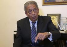 Former foreign minister and presidential candidate Amr Moussa speaks during an interview with Reuters in Cairo