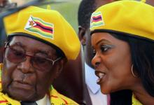 President Robert Mugabe listens to his wife Grace Mugabe at a rally of his ruling ZANU-PF party in Harare, Zimbabwe, November 8, 2017. PHOTO BY REUTERS/Philimon Bulawayo