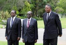 Then-Zimbabwe President Robert Mugabe is seen with vice presidents Phelekezela Mphoko (R) and Emmerson Mnangagwa (L) at State House in Harare, December 12, 2014. PHOTO BY REUTERS/Philimon Bulawayo