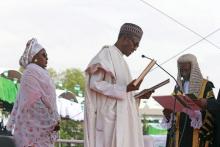 Chief Justice of Nigeria Mahmud Mohammed swears in Muhammadu Buhari (C) as Nigeria's president while Buhari's wife Aisha looks on at Eagle Square in Abuja, Nigeria, May 29, 2015. PHOTO BY REUTERS/Afolabi Sotunde