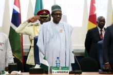 Nigeria's President Muhammadu Buhari (C) stands at the opening of the 48th ordinary session of ECOWAS Authority of Head of States and Government in Abuja, Nigeria, December 16, 2015. PHOTO BY REUTERS/Afolabi Sotunde