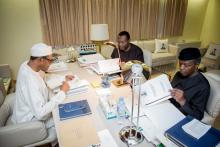 President Muhammadu Buhari, Vice President Yemi Osinbajo and Minister of Budget and National Planning Senator Udoma Udo Udoma read copies of the details of the submitted 2016 national budget by the National Assembly in Abuja, Nigeria, April 10, 2016. PHOTO BY REUTERS/Stringer