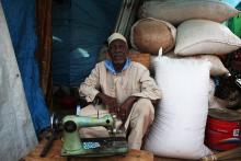 An elderly Muslim man sits in his temporary shop shelter at Ecole Liberte (Freedom School) in Bossangoa, north of the capital Bangui in the Central African Republic