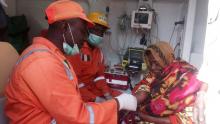 National Emergency Management Agency (NEMA) workers attend to a woman after suicide bombers detonated their explosives along Muna Garage in Maiduguri, Nigeria, March 15, 2017. PHOTO BY NEMA