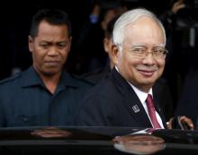 Malaysia's Prime Minister Najib Razak leaves parliament in Kuala Lumpur, Malaysia, January 26, 2016. PHOTO BY REUTERS/Olivia Harris