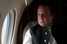 Pakistani Prime Minister Nawaz Sharif looks out the window of his plane after attending a ceremony to inaugurate the M9 motorway between Karachi and Hyderabad, Pakistan, February 3, 2017. PHOTO BY REUTERS/Caren Firouz