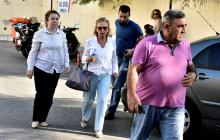Turkish journalist Nazli Ilicak (C), also a well-known commentator and former parliamentarian, is escorted by a police officer (R) and her relatives (L and rear) after being detained and brought to a hospital for a medical check in Bodrum, Turkey, July 26, 2016. PHOTO BY REUTERS/Kenan Gurbuz