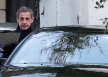 Former French President Nicolas Sarkozy enters his car as he leaves his house in Paris, France, March 21, 2018. PHOTO BY REUTERS/Benoit Tessier